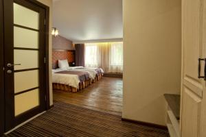 Кровать или кровати в номере Apart Hotel Kvartira 1