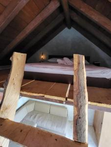 a bedroom with two bunk beds in a attic at Miki's Little House in Supetar +1 photo