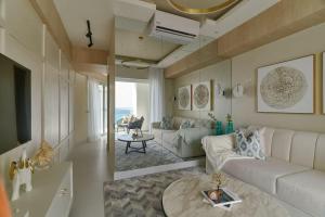 a living room with a couch and a table at Aquarella Caribbean Paradise Playa Juan Dolio in La Puntica de Juan Dolio