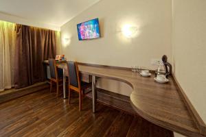 Телевизор и/или развлекательный центр в Apart Hotel Kvartira 1