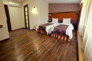 Кровать или кровати в номере Apart Hotel Kvartira 1