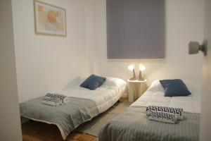 Ένα ή περισσότερα κρεβάτια σε δωμάτιο στο Elegant Apartment in Madrid 5 a 6 pax