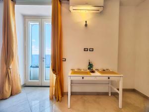 a bathroom with a white sink and a window at Villa Mansi Amalfi Coast- Sea View Free Park in Atrani