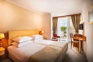 Postel nebo postele na pokoji v ubytování Sunny Baška Residence by Valamar, ex Zvonimir + 24 fotografií
