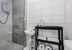 a small bathroom with a sink and a shower at TTSA - Studio - Norwood Junction - 10 in Norwood