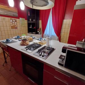 a kitchen with a stove and a counter top at B&B Miele in San Fermo della Battaglia +45 photos