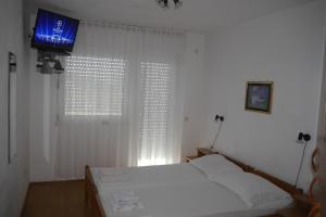 Postel nebo postele na pokoji v ubytování Apartments Horizont