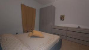 Ένα ή περισσότερα κρεβάτια σε δωμάτιο στο La Casa dei Nonni +2 φωτογραφίες