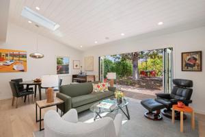 a living room with a couch and chairs and a table at Mesa Breeze by Paradise Retreats in Santa Barbara
