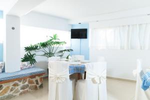 a dining room with a table and chairs at Saraya Resort in Alinda