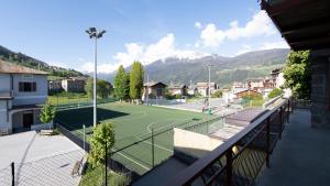 a tennis court with a tennis court at Morcelli 4 - Bajona in Bormio
