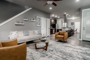 a living room with a couch and a table at Austin Retreat Hot Tub and Relaxing Patio in Austin