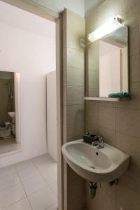 a bathroom with a sink and a mirror at Paraspori in Adamas