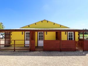 a yellow and orange house with a porch at Dakota in Lincoln