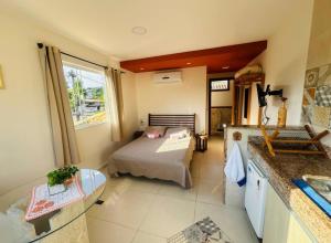 En eller flere senge i et værelse på Flat Buziano