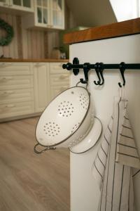 a sink hanging on a wall in a kitchen at Ferienwohnung Am Hafen in Bleckede +17 photos