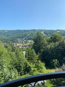 a view of a valley with trees and buildings at Dom Na Widoku w górach Szczyrk in Szczyrk