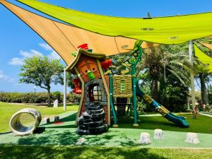 a playground in a park with a slide at גיל נכסים - Gil Estate in Caesarea