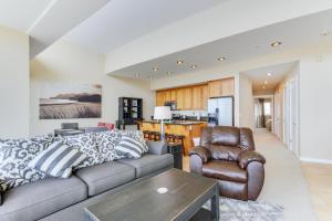 a living room with a couch and a table at Romantic Manhattan Beach Sunset #202 in Rockaway Beach +23 photos