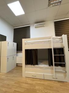 a bedroom with a bunk bed in a room at FRIENDS Hostel Baku in Baku