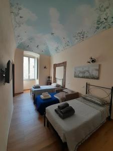 Ένα ή περισσότερα κρεβάτια σε δωμάτιο στο Apartment Centro Storico Il cielo in una stanza