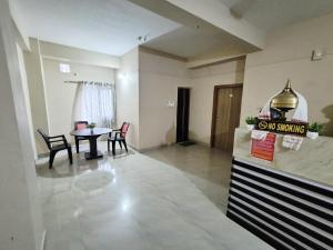 a large living room with a table and chairs at Serene Dawn Homestay in Guwahati