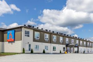 a building with a sign on the top of it at Studio 6 Hornepayne, ON in Hornepayne