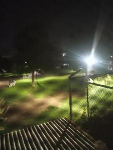 a view of a park at night with a light at Cuarto amueblado in Guadalajara
