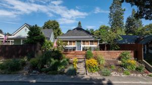 a house with a wooden fence in front of it at Pengs Place in Coeur d'Alene