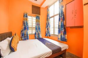 Postel nebo postele na pokoji v ubytování Hotel O Petals Residency + 36 fotografií