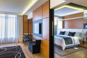 Postel nebo postele na pokoji v ubytování Radisson Hotel Curitiba