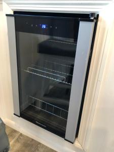 an oven with the door open in a kitchen at Baycation Houseboat in Tavernier