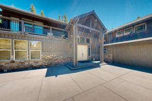 a large house with a garage in front of it at 3 Quelah in Sunriver