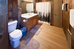 a bathroom with a toilet and a sink at Vernal Vista in Yosemite West +5 photos