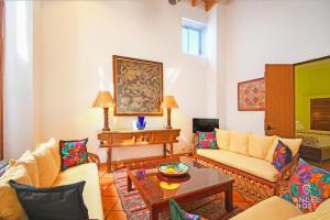 a living room with couches and a table at Private pool, Oceanview Rooftop in Historic La Paz in La Paz +61 photos