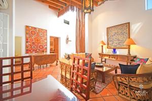 a living room with a couch and a table at Private pool, Oceanview Rooftop in Historic La Paz in La Paz