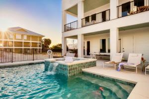 a swimming pool in the middle of a house at Whitecap - Beachfront Gem with Pool & Elevator in Orange Beach