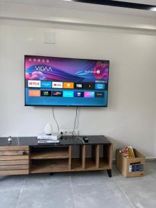 a flat screen tv hanging on a wall at Erdem Apart77 in Dalaman +4 photos