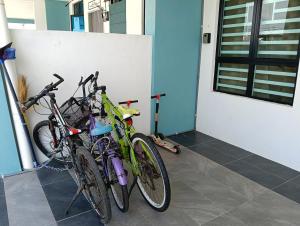 a group of bikes parked next to a door at Homestay impian, arau in Arau