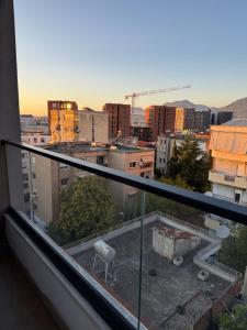 a view of a city from a balcony at Bejart Apartment 7 in Tirana +18 photos