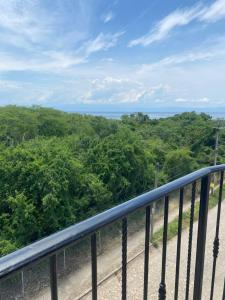 a view of the ocean from the balcony of a resort at Casitas Las Palmas - Coral de Mar in Punta Mita +5 photos
