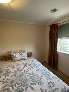 a bedroom with a bed with a pillow and a window at DoncasterRoom#nearCity&Freeway&Bus#WestfieldShoppingCentre in Doncaster