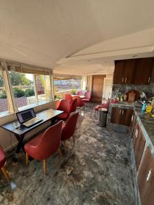 a kitchen with a table with a laptop on it at La Vien Hotel Old City in Istanbul