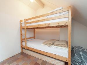 a couple of bunk beds in a room at Holiday Home in Schoorl near Dunes in Schoorl