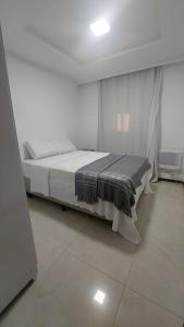 Ένα ή περισσότερα κρεβάτια σε δωμάτιο στο Apartamento Vila Velha facing Praia de Itapoã