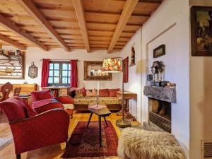 a living room with a couch and a fireplace at Holiday Home in Edlitz near Ski Slopes in Edlitz