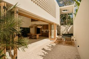 an external view of a house with a courtyard at COZ Bali Boutique Villas walking distance to Padang Padang Beach in Uluwatu