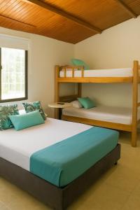 Postel nebo postele na pokoji v ubytování Mucho lo Bueno - Hostel House