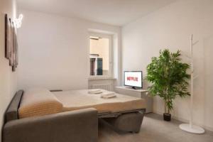 a living room with a couch and a table at Suite Diamante Luxury Apartment - Center - Lake in Torri del Benaco