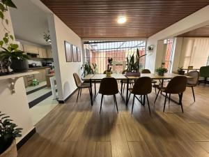 a dining room and kitchen with a table and chairs at 313homebogotá in Bogotá